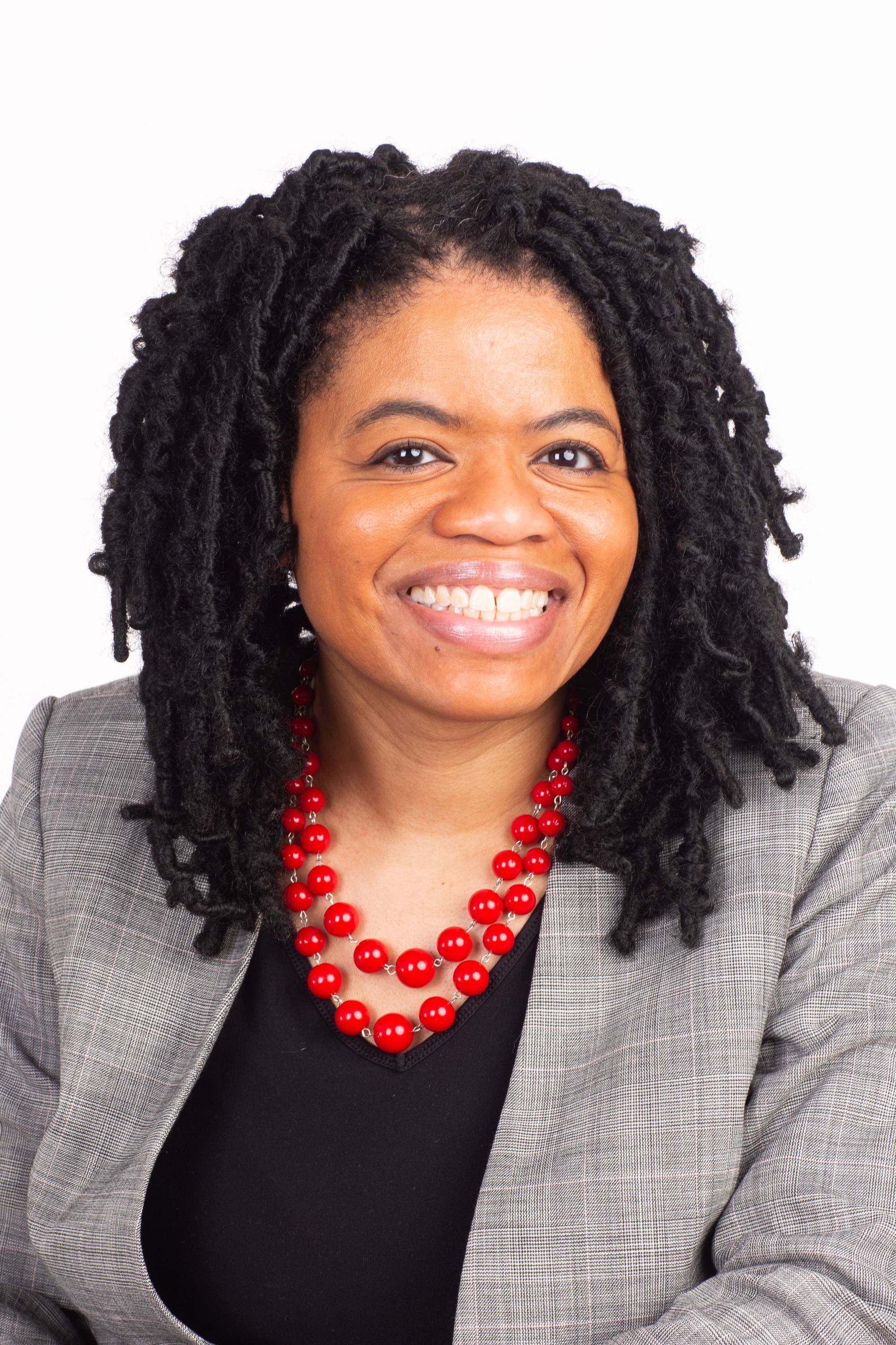Woman in a suit smiling
